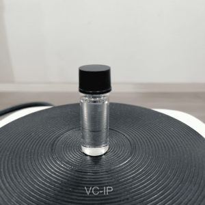 A pure sample of Ascorbyl Tetraisopalmitate Huachem, presented in a clear glass bottle to showcase its quality and consistency as a warming agent.