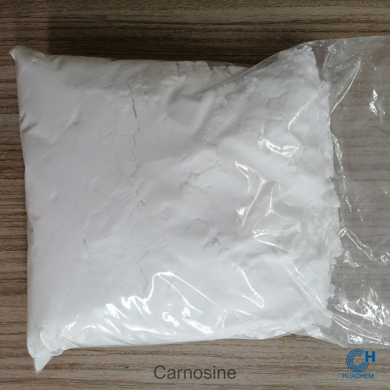 Huachem Carnosine white powder visibly sealed inside a transparent inner polyethylene bag.