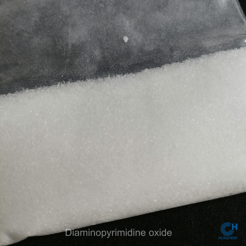 Macro photography revealing the fine, uniform, white powder texture of Huachem Diaminopyrimidine Oxide.