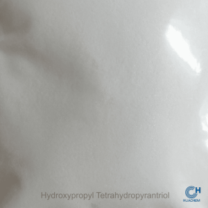 Macro photography revealing the fine, uniform, white powder texture of Huachem Hydroxypropyl Tetrahydropyrantriol.