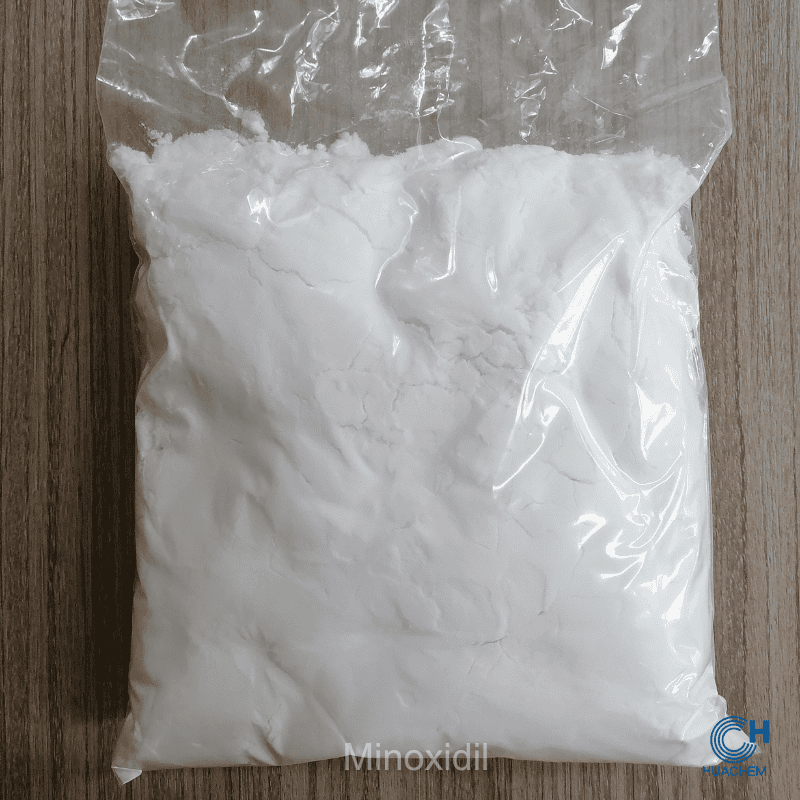 Huachem Minoxidil white powder visibly sealed inside a transparent inner polyethylene bag.