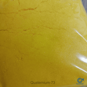 Macro photography revealing the fine, uniform, yellow powder texture of Huachem Quaternium-73.