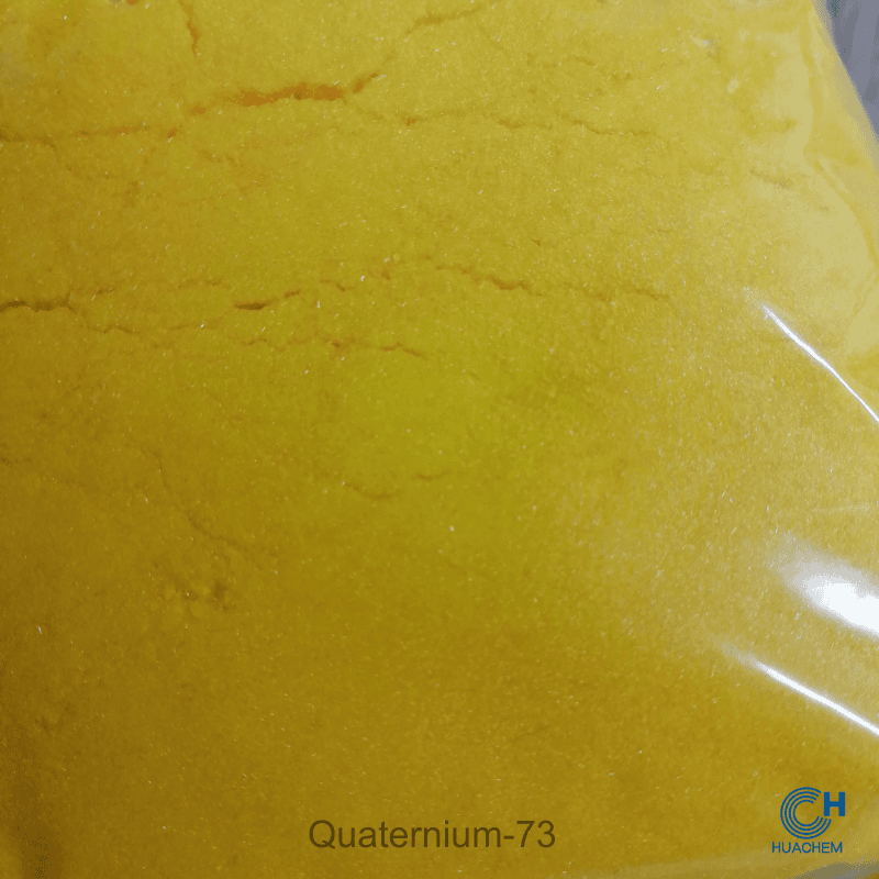 Macro photography revealing the fine, uniform, yellow powder texture of Huachem Quaternium-73.