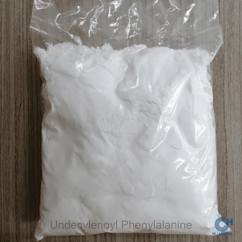 Huachem Undecylenoyl Phenylalanine white powder visibly sealed inside a transparent inner polyethylene bag.